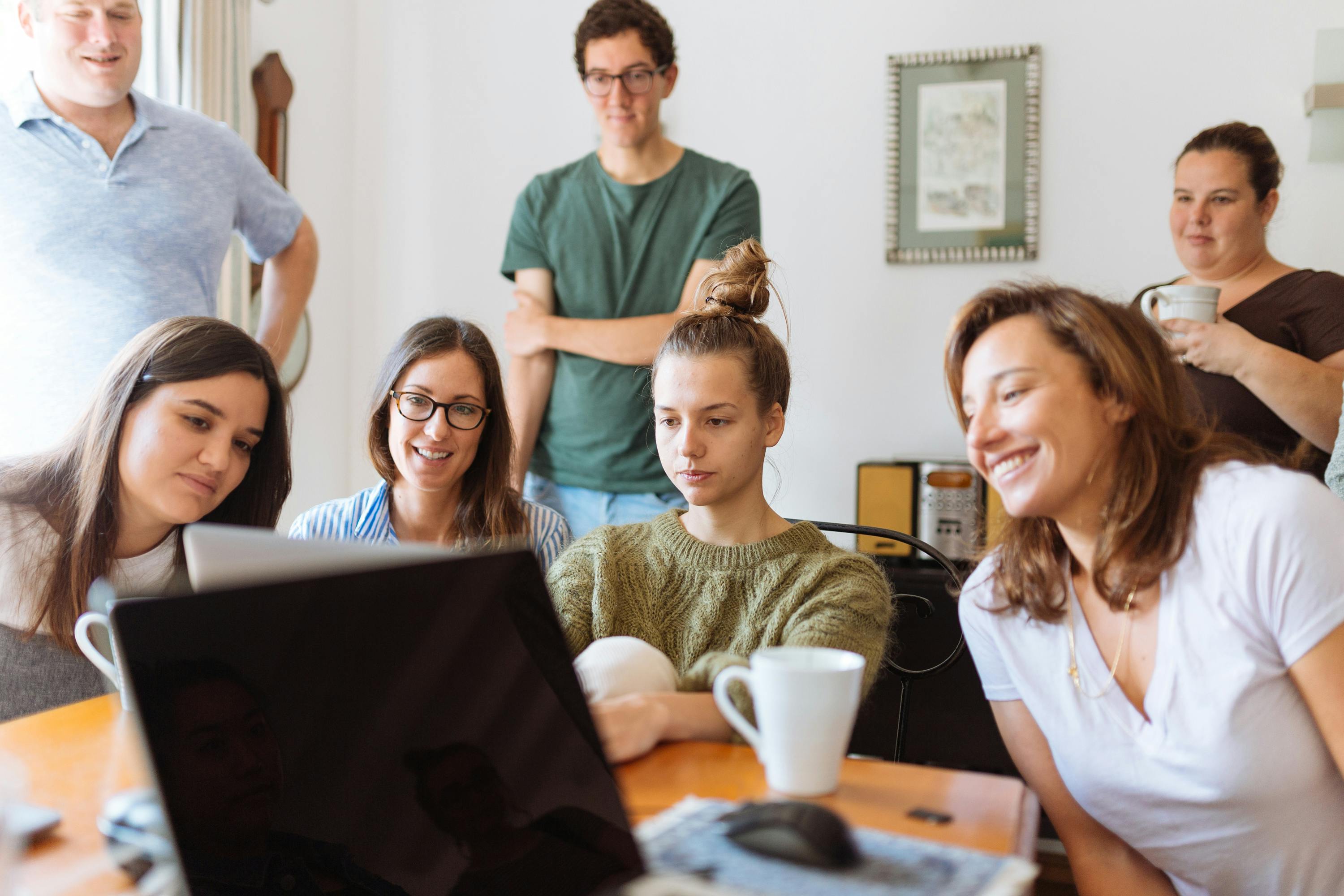 Family looking at story on laptop